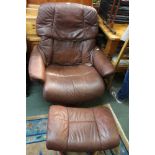 A Ekornes stressless leather armchair with matching foot stool