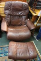 A Ekornes stressless leather armchair with matching foot stool