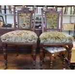 A pair of Edwardian dining chairs with upholstered seats and backs