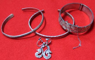 A collection of three silver bracelets, only one hallmarked the other two white metal, earrings are