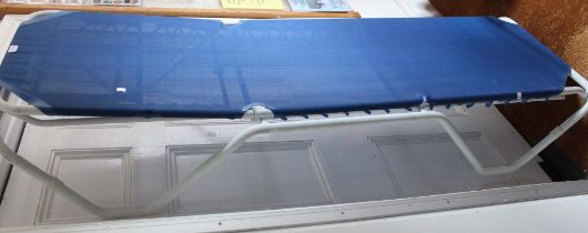 A metal framed and blue nylon fabric sun lounger