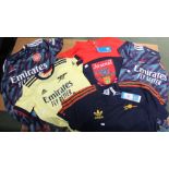 An "Arsenal" football club Hoodie, and two adult and two children's "Arsenal" football shirts (5)