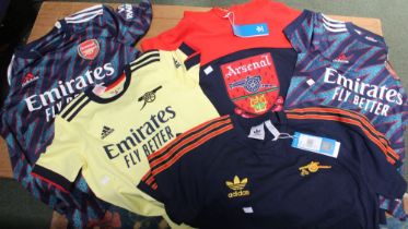 An "Arsenal" football club Hoodie, and two adult and two children's "Arsenal" football shirts (5)
