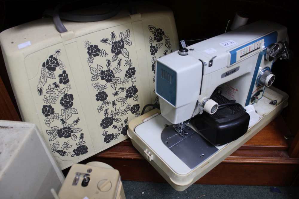 A vintage Jones electric oeddle sewing machine in carry case