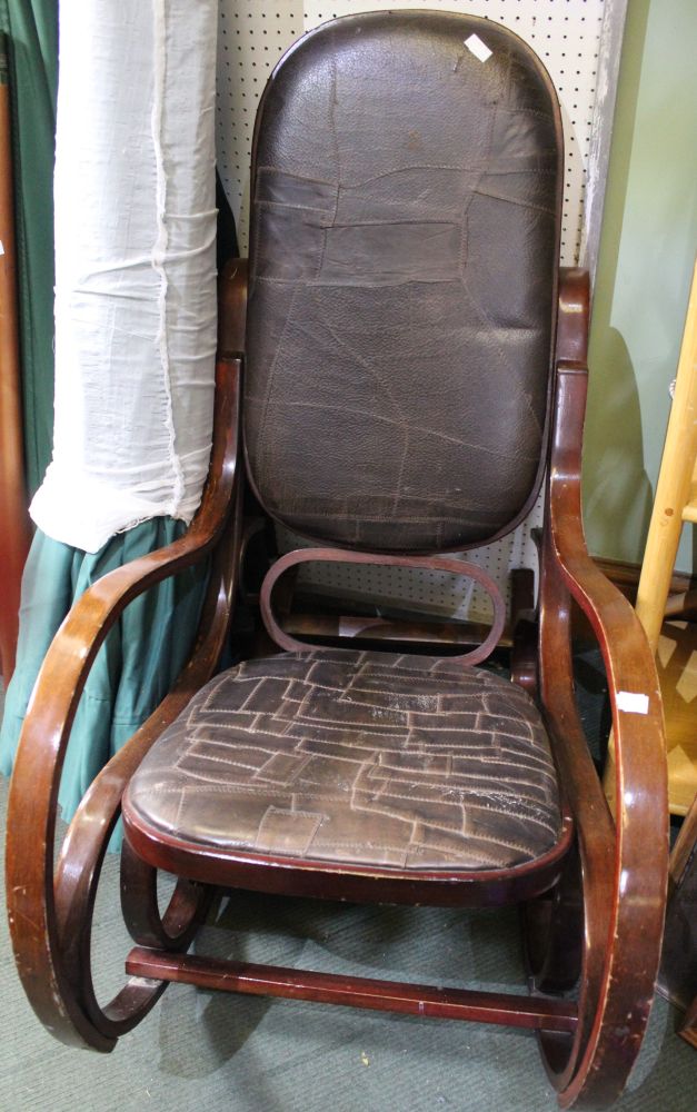 A vintage wood & leather rocker chair