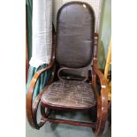 A vintage wood & leather rocker chair