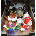 A pottery "Father Christmas" teapot together with a selection of various decorative teapots (10)
