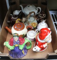 A pottery "Father Christmas" teapot together with a selection of various decorative teapots (10)