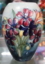 A Moorcroft vase, tube lined and hand painted Lily decoration, painted and impressed factory marks t