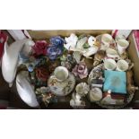A box of assorted decorative wares, includes two "Poole" dolphins