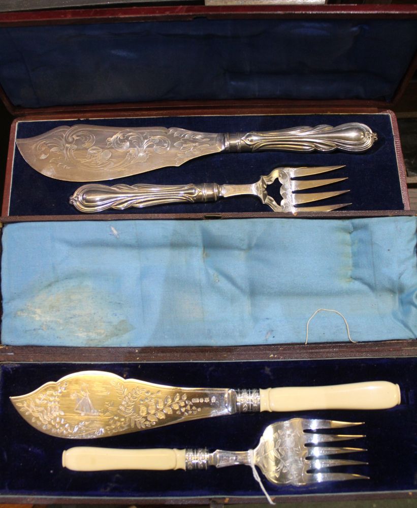 Two cased pairs of later Victorian fish servers