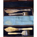 Two cased pairs of later Victorian fish servers