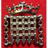 A 9ct gold portcullis MP badge, 7g