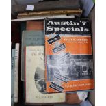 A box containing a quantity of vintage car manuals, hand books, etc