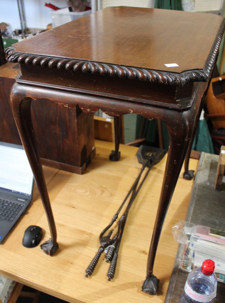 A 20th century mahogany centre table, cabriole legs on ball & talon feet