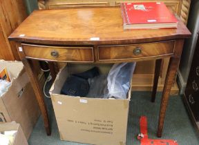 A reproduction mahogany two drawer bow front side table