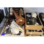 Four wooden trays containing a selection of domestic and collectible items. flat ware, costume