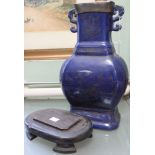 An early 20th century blue glazed ceramic vase, fitted two handles, having pewter mounted rim, yello