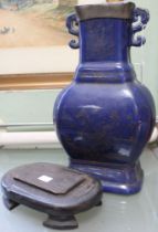 An early 20th century blue glazed ceramic vase, fitted two handles, having pewter mounted rim, yello