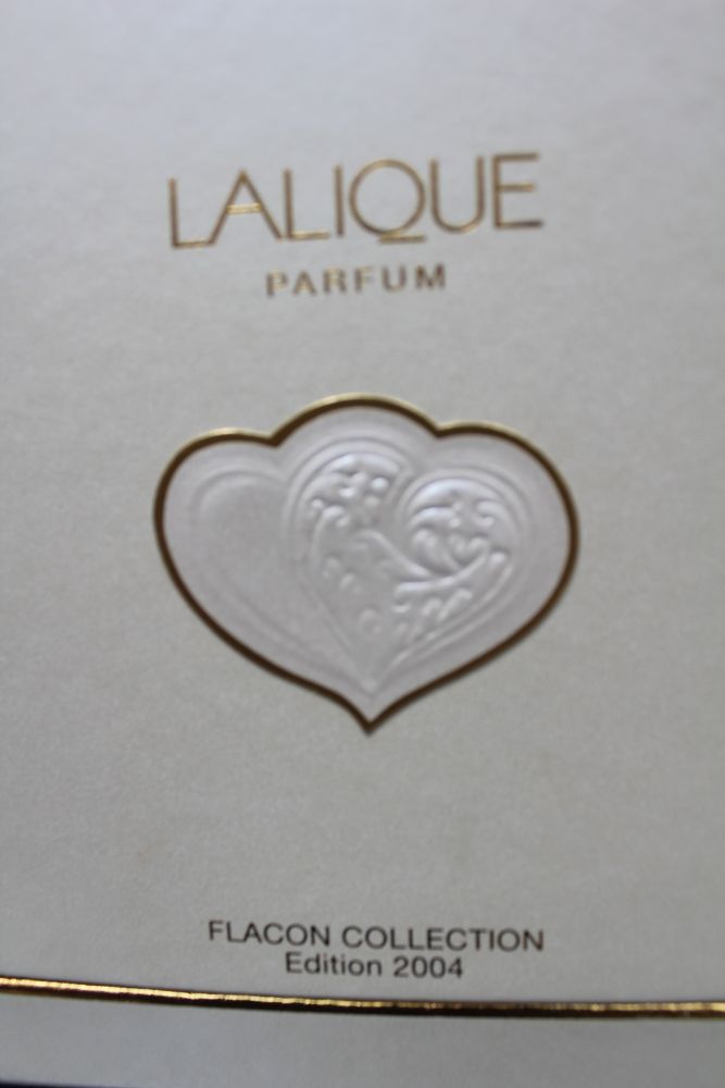 A Lalique perfume bottle, designed as conjoined hearts, still full and in original packaging, with l - Image 3 of 3