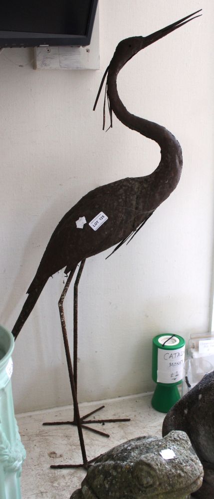 A metal garden ornament in the form of a Stork