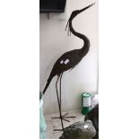 A metal garden ornament in the form of a Stork