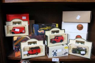 14 boxed die cast model vehicles to include three Formula One examples