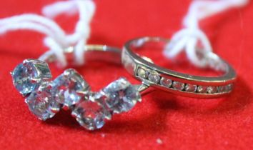 A silver stone set dress ring, together with a half eternity ring (2)