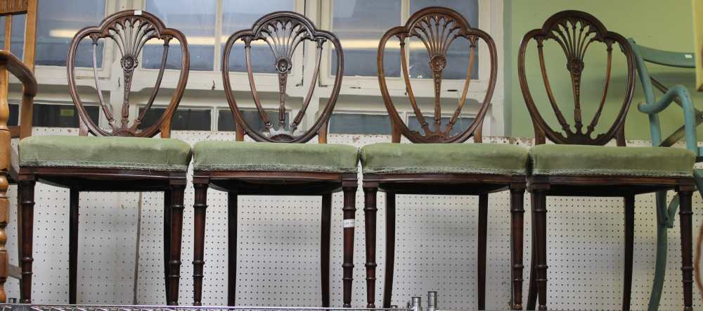 Four 19th century Sheraton style mahogany dining chairs, with upholstered seats