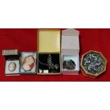 A selection of costume jewellery to include cameo's, marcasite sterling silver brooch, etc