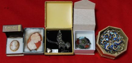 A selection of costume jewellery to include cameo's, marcasite sterling silver brooch, etc