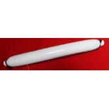 A mid-19th century milk white opaque glass rolling pin, 76cm long