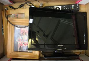 A box containing three pine framed prints and a small television set with remote