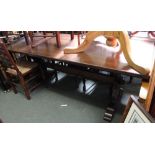 A dark oak tavern style dining table on twin liar style legs pegged stretcher 84 x 198 cm