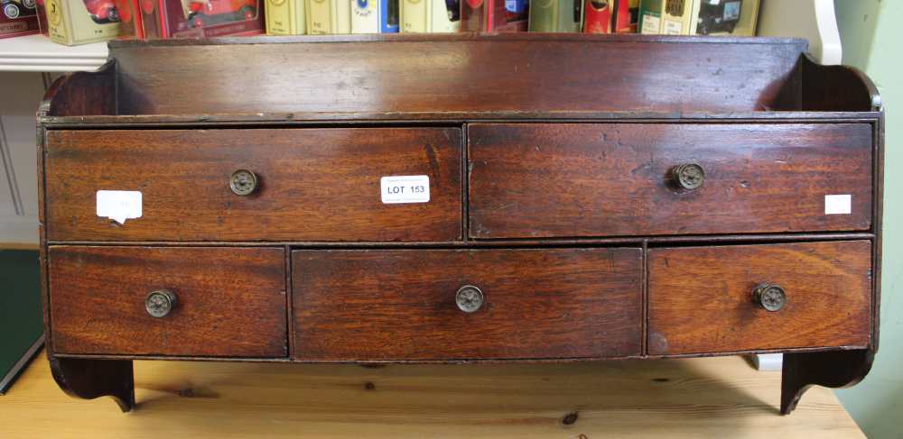 A 19th century mahogany wall hanging set of five drawers