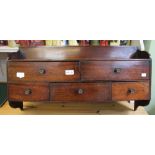 A 19th century mahogany wall hanging set of five drawers