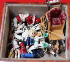 A collection of twelve painted cast metal miniatures, includes Dolls, Bath chair etc (originally fro