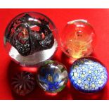 A selection of five paperweights