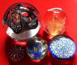 A selection of five paperweights