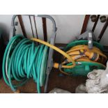 Two garden hoses on reels