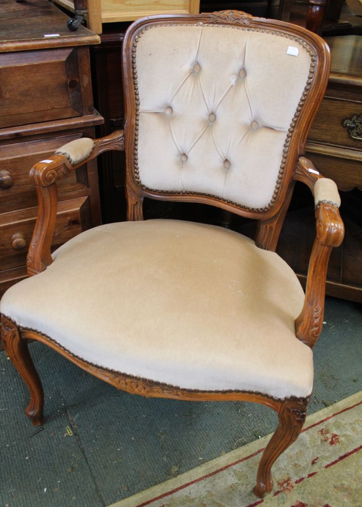 A show wood an upholstered armchair