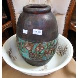 A large vintage ceramic bowl with a papier Mache pot