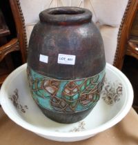 A large vintage ceramic bowl with a papier Mache pot