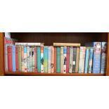 WE Johns "Biggles" a shelf ontaining a selection of Biggles hardbacks, etc.