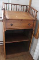 A 19th century pine clerks desk with lift up lid and single drawer, gallery back