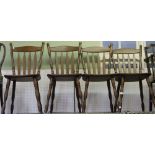 A set of four modern hard wood kitchen/dining chairs