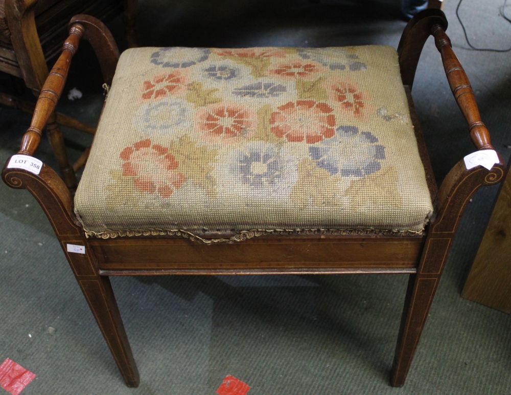 An Edwardian inlaid mahogany piano stool with lift up tapestry upholstered lid