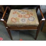 An Edwardian inlaid mahogany piano stool with lift up tapestry upholstered lid