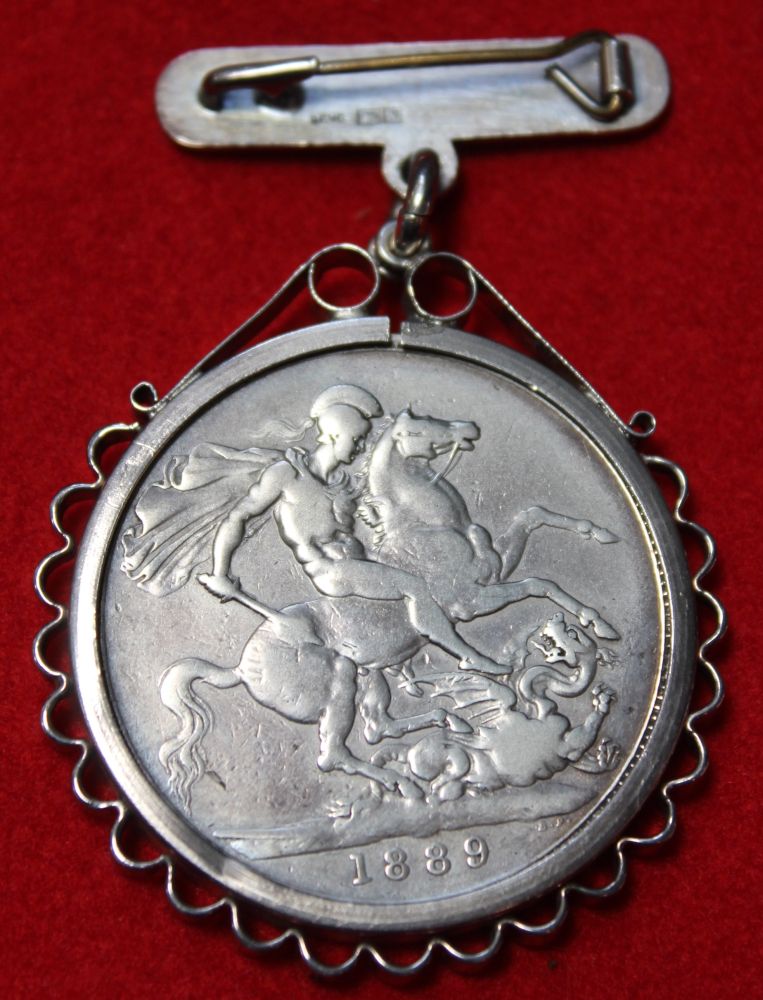 A Victorian silver crown 1889, in a brooch mount, gross weight 39g - Image 2 of 2