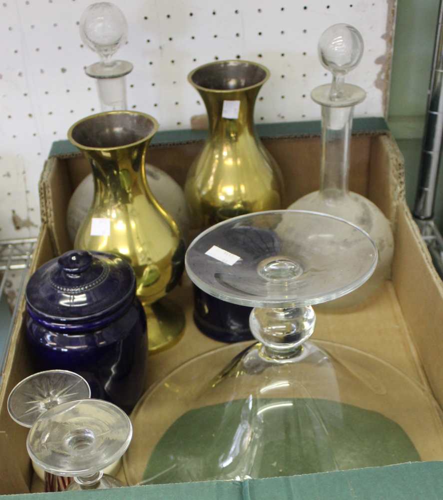 A box containing a pair of brass vases, two decanters and various other glass and china wares